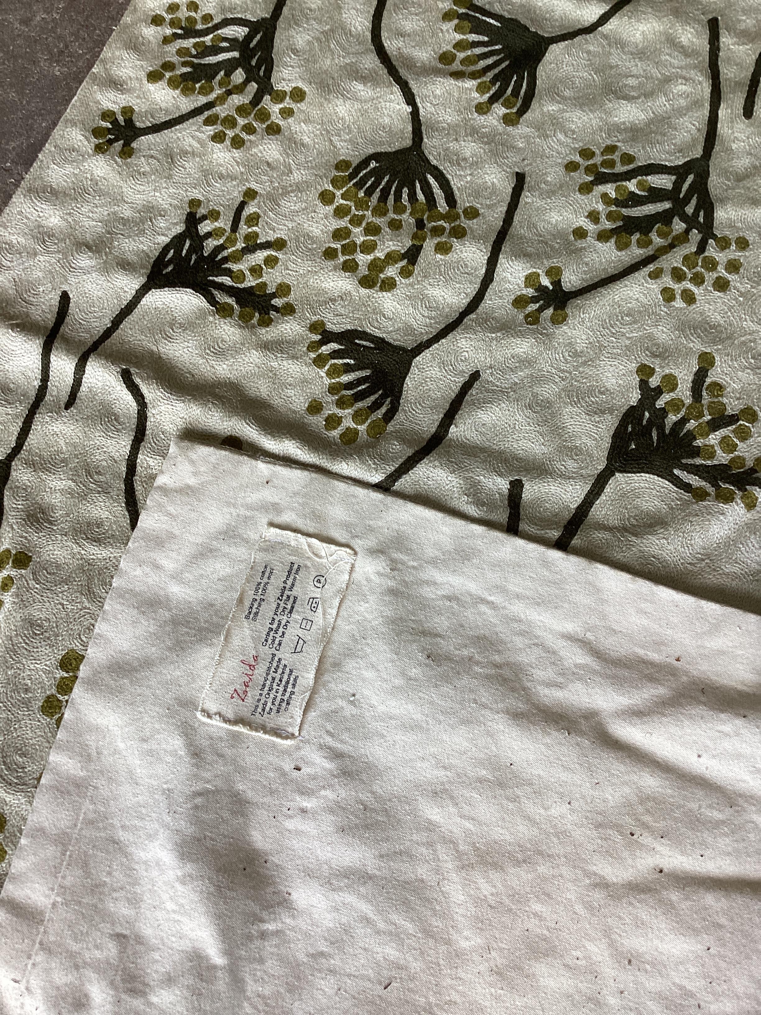 An Indian cotton and stitched wool rug, 180 x120cm